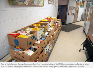 image of hallway at MTM Community Center showing boxes for food pantry recipients