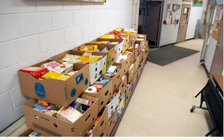 image of hallway at MTM Community Center showing boxes for food pantry recipients